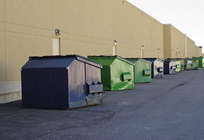 metallic dumpster units staged for construction garbage in Ethel